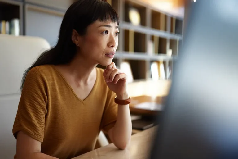 professional woman concentrating on computer monitor