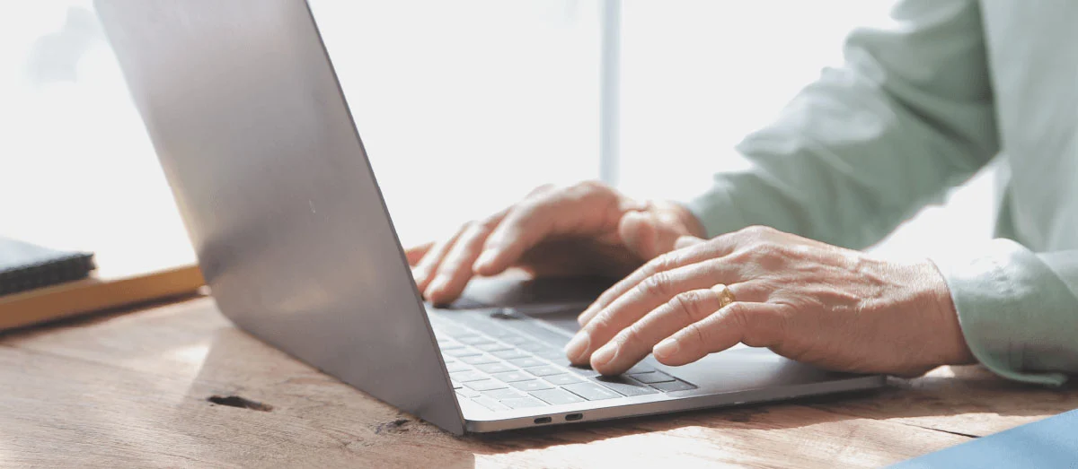 Man typing on laptop