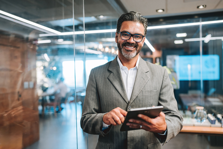 Executive holding a tablet