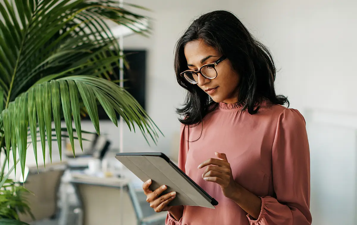 Young Indian Businesswoman Using Digital Tablet in Office