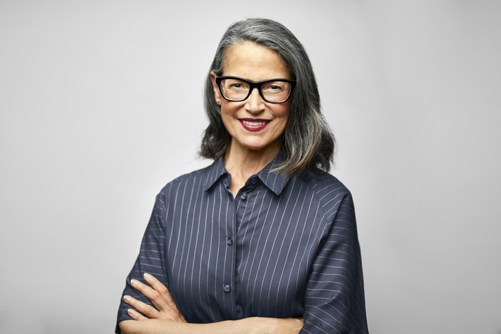 Mature female CEO with arms crossed