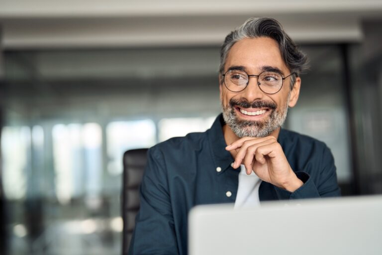 Mature businessman smiling in an office