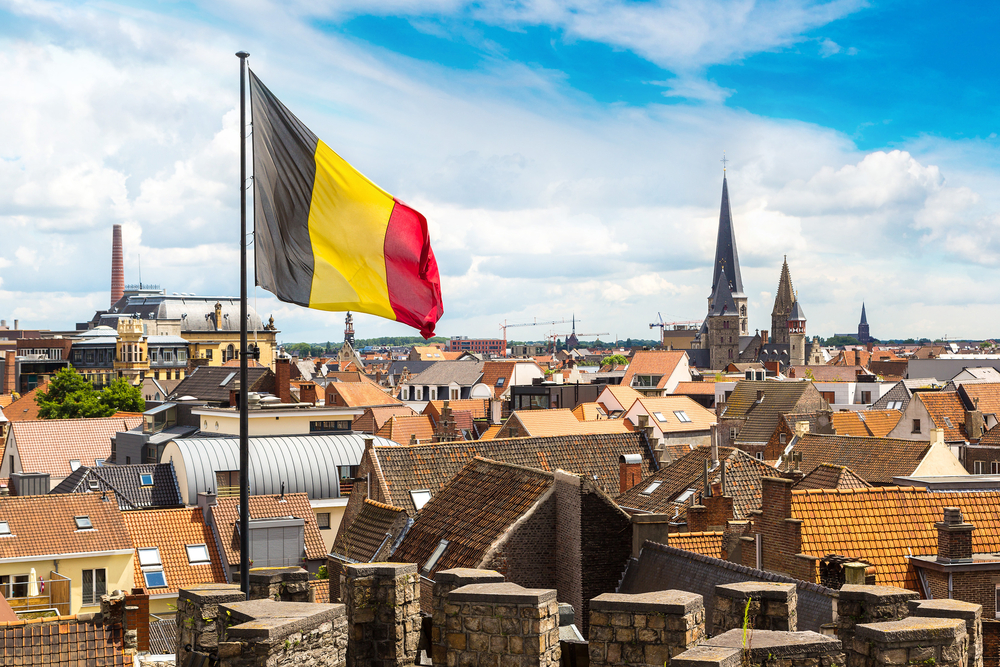 Belgian flag flying above city