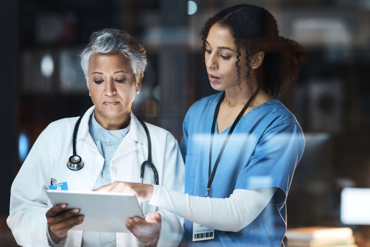 Doctor and nurse looking at tablet together