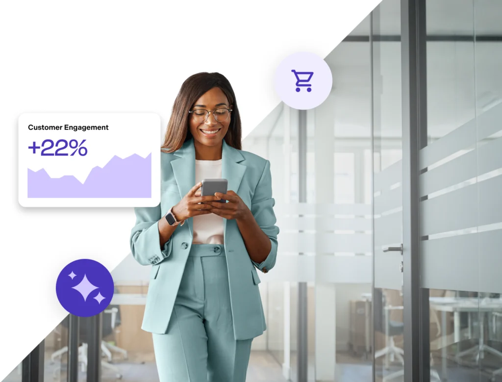 A women looking at her mobile phone in an office environment noticing that customer engagement has increased