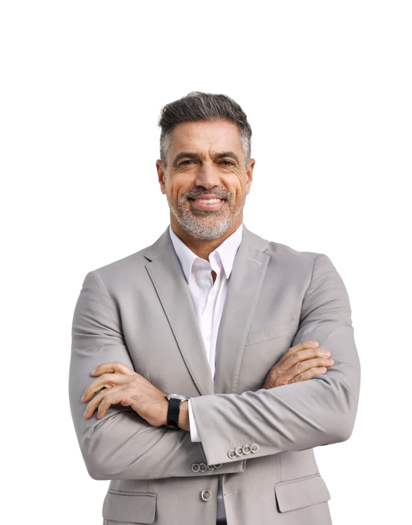 A man with his arms crossed in a gray suit
