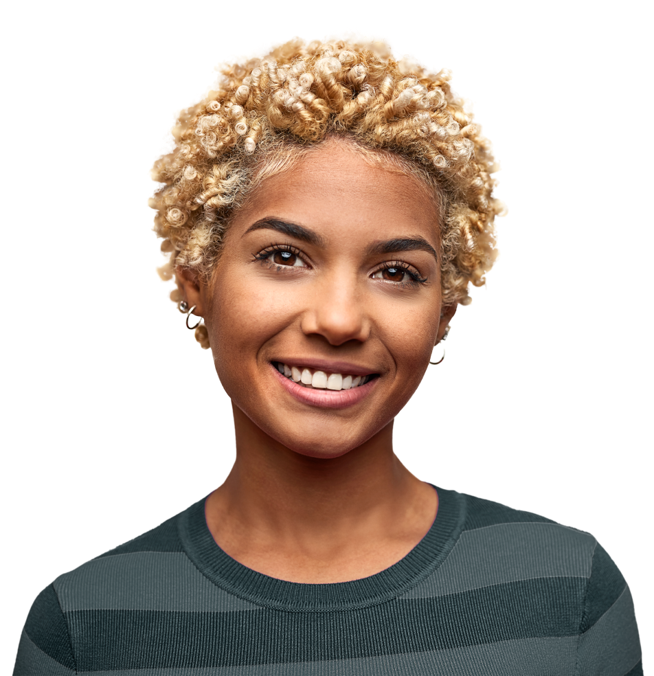 A woman smiles while looking directly at the camera