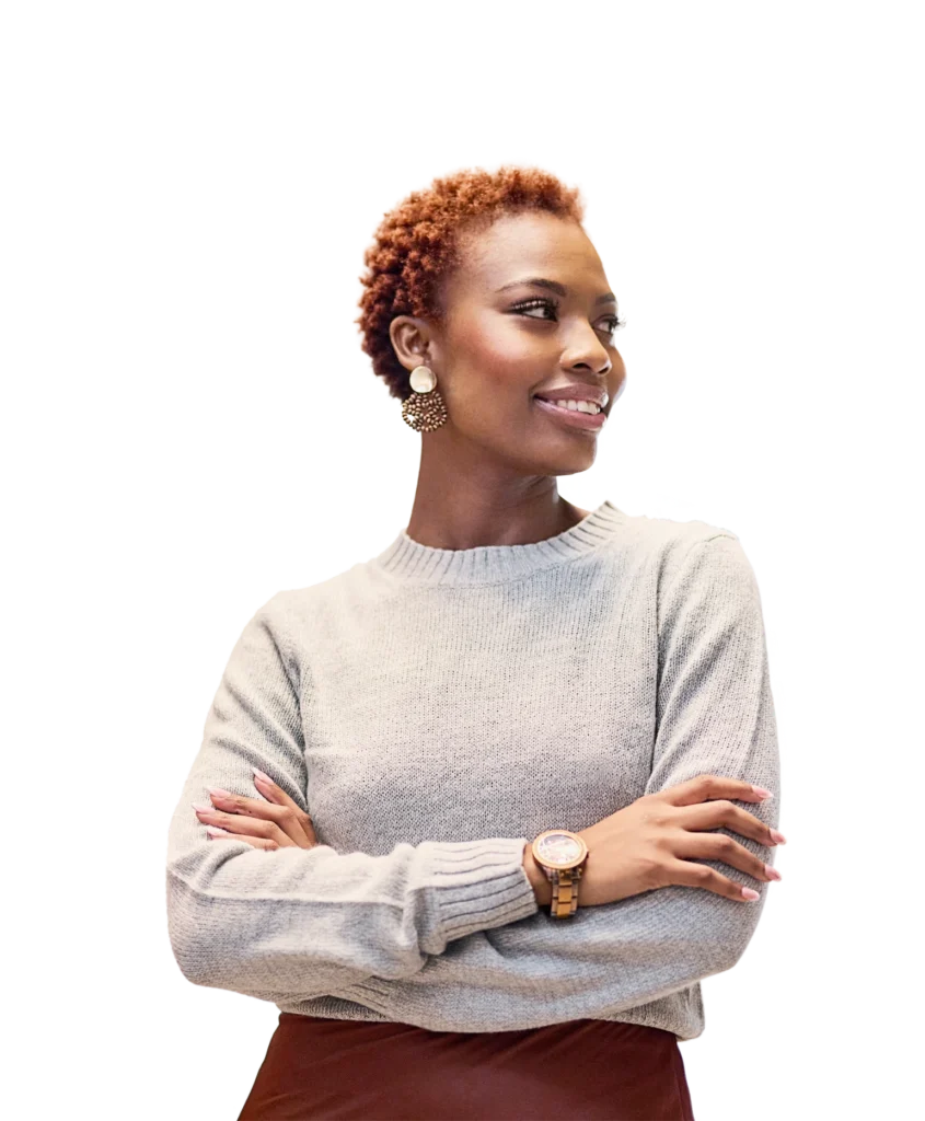 A woman with her arms crossed, smiling, looking to her left