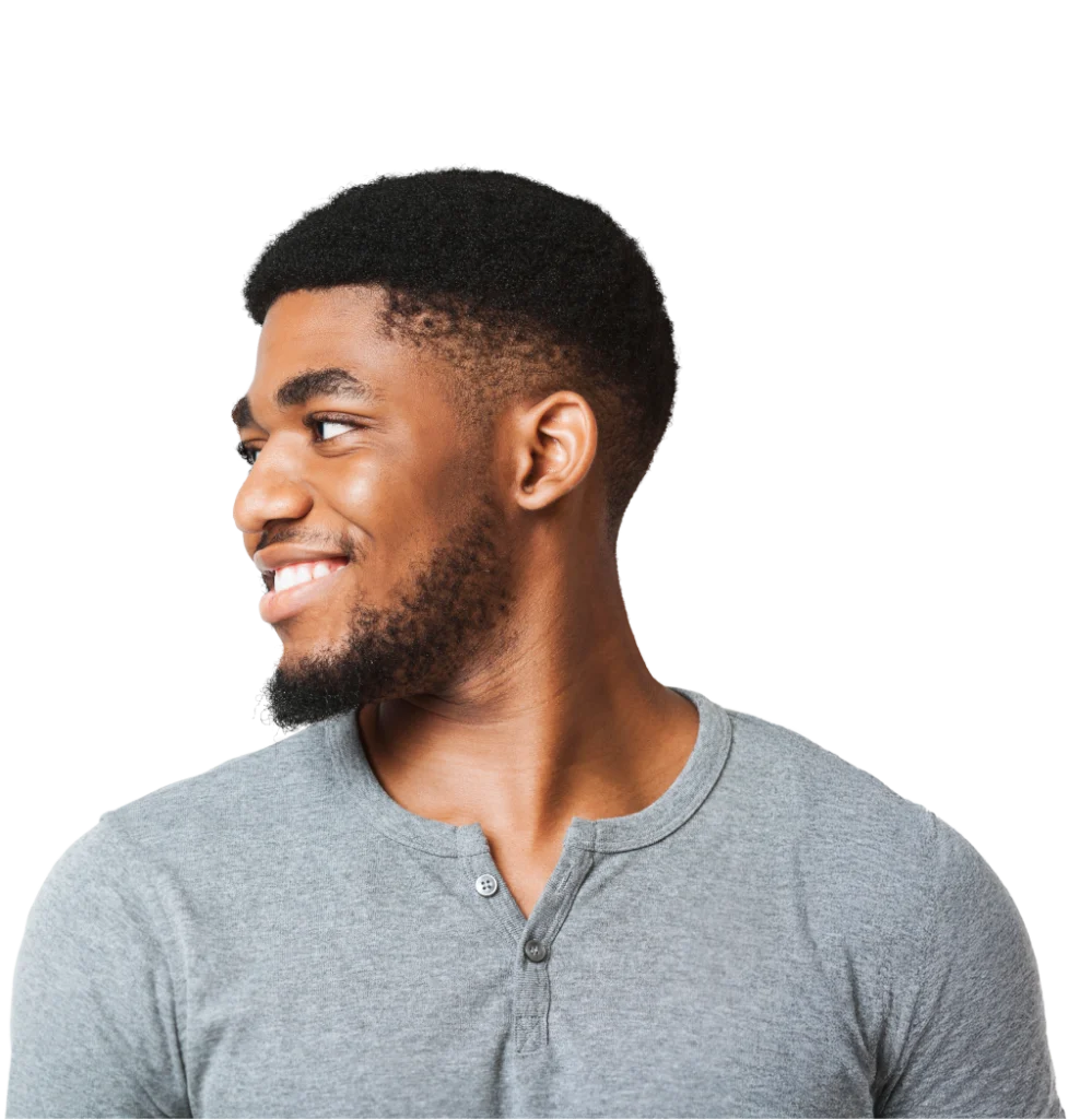 A man smiles and looks to his right