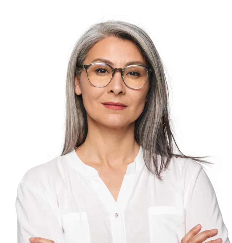 A woman looks directly at the camera with her arms cross