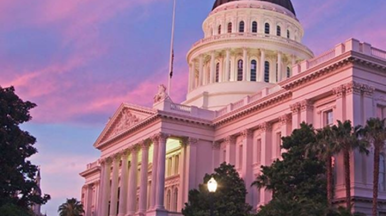 A capitol building at sunset