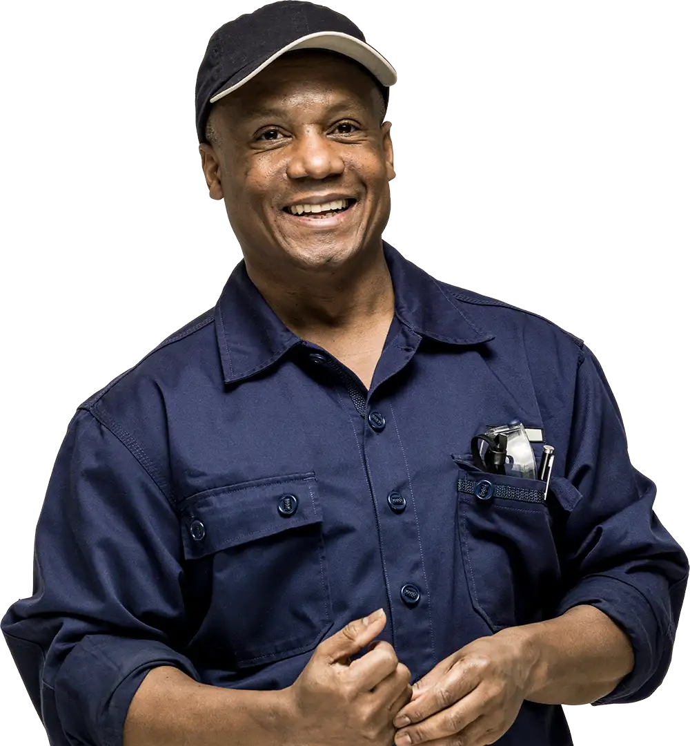 older man in work shirt and ballcap and hands clasped