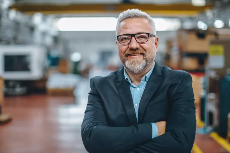 finance leader standing on a factory floor