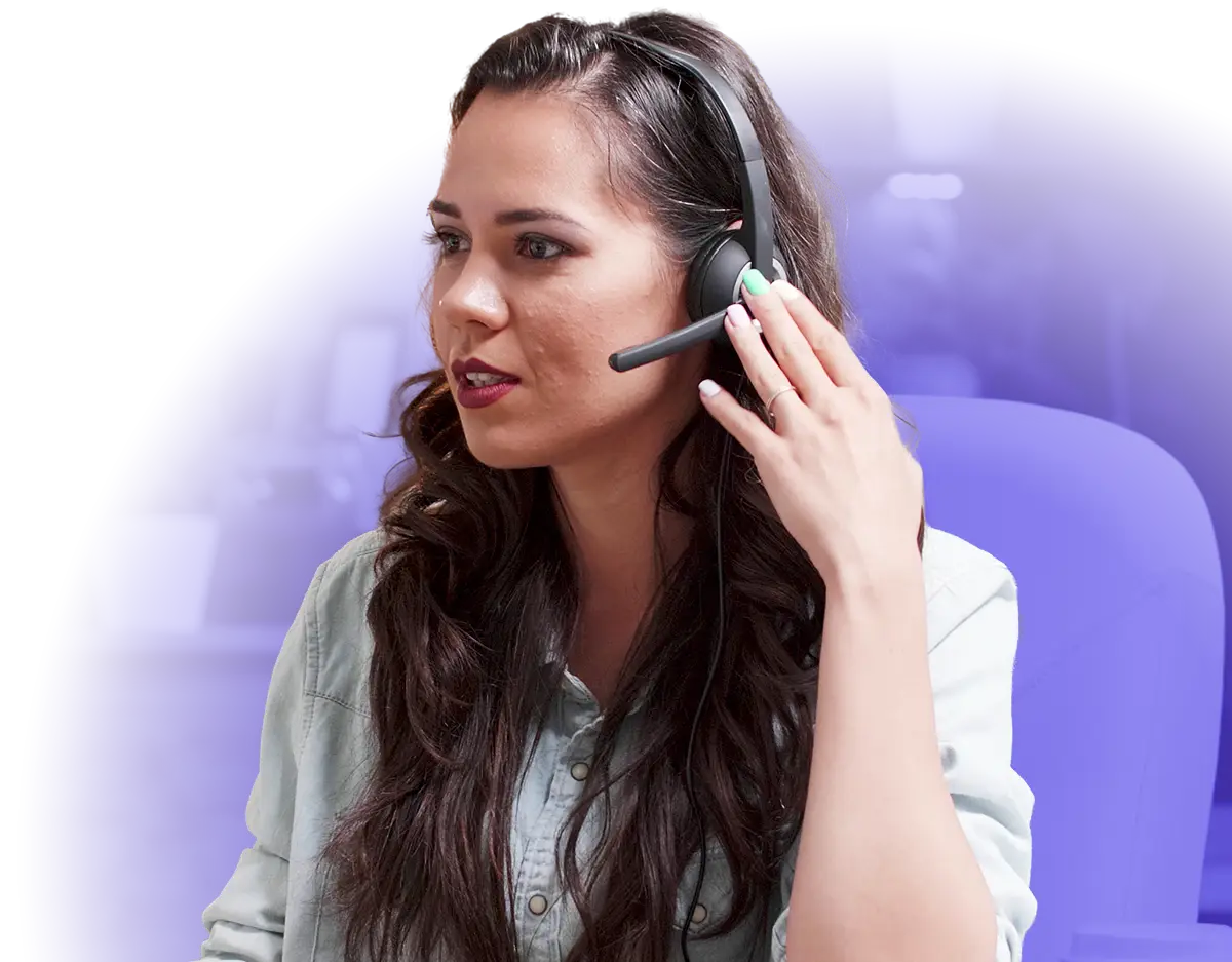 Woman sitting with headset speaking to someone