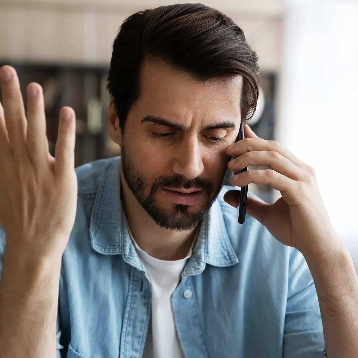 frustrated man on the phone