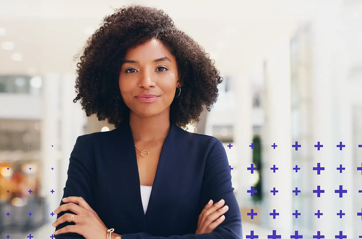 Confident modern businesswoman with arms crossed looking at camera