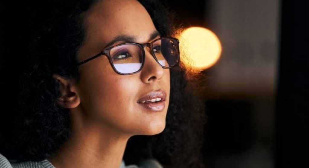 Professional woman wearing glasses with an inspired expression