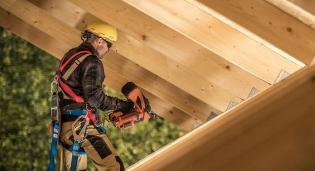 Carpenter building a roof