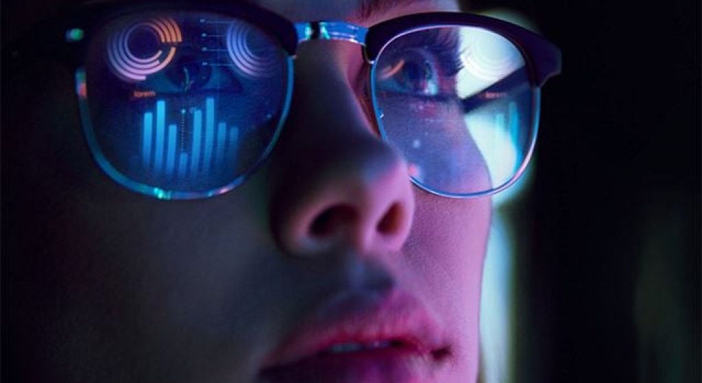 Woman's Face with Bar Graph Reflecting in Glasses