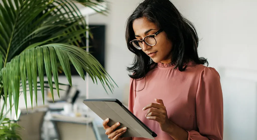Young Indian Businesswoman Using Digital Tablet in Office
