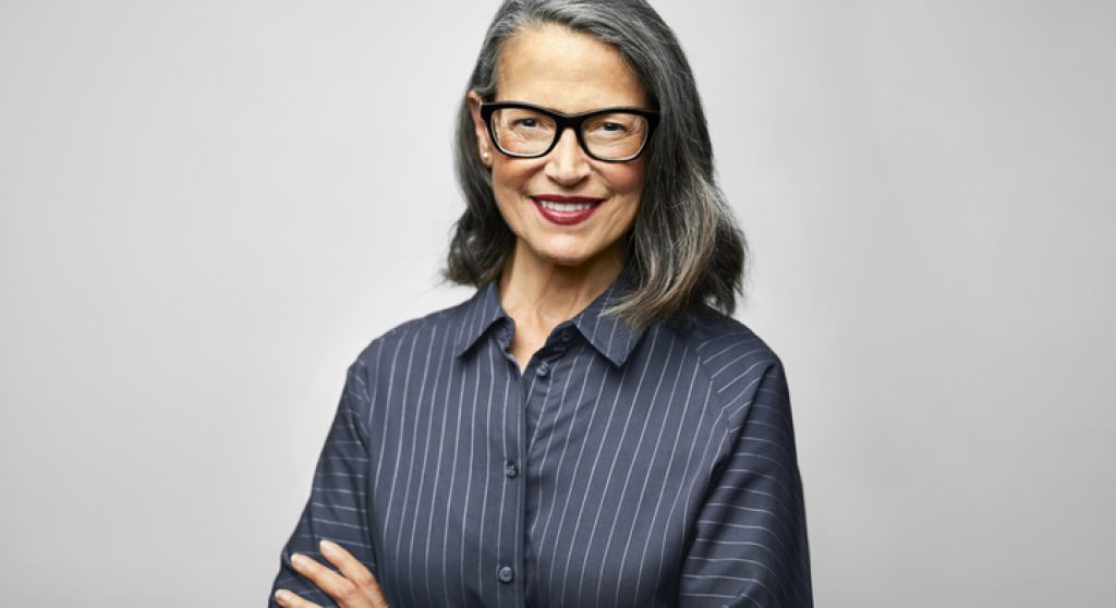 Mature female CEO with arms crossed