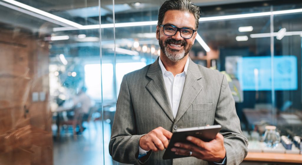 Executive holding a tablet