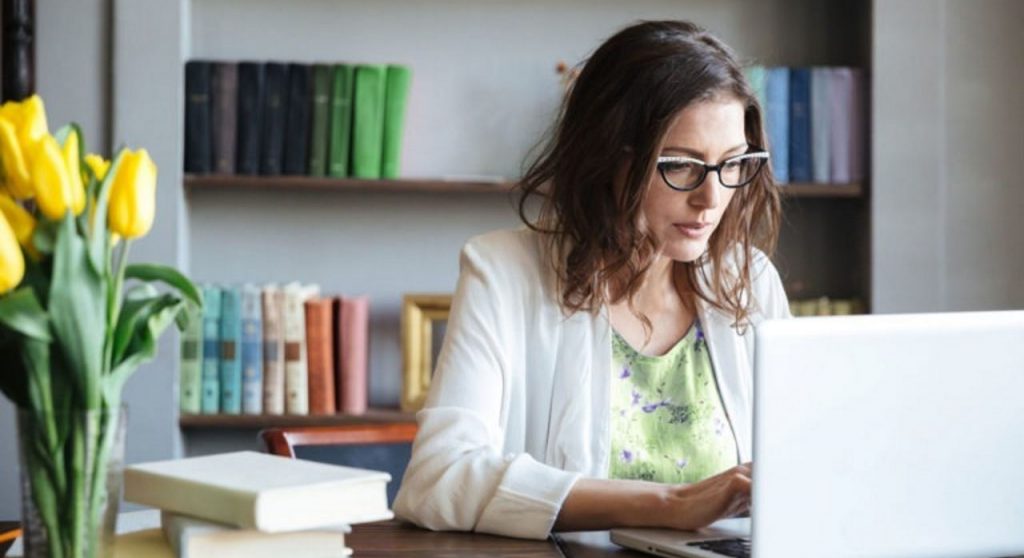 woman in her office using a laptop