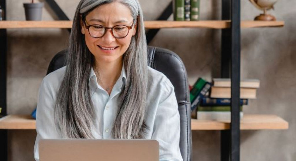 Finance executive using computer in office