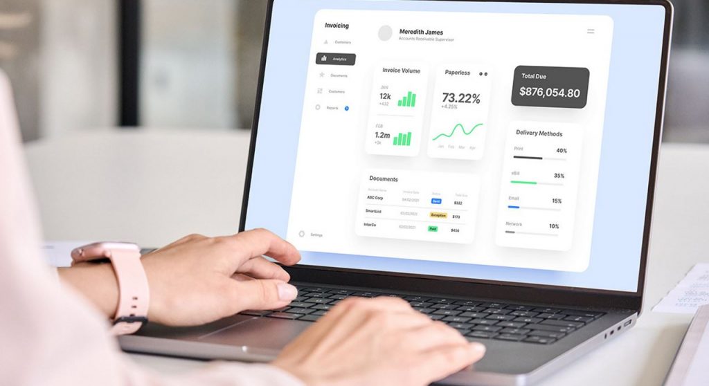 Woman using invoicing software in an office