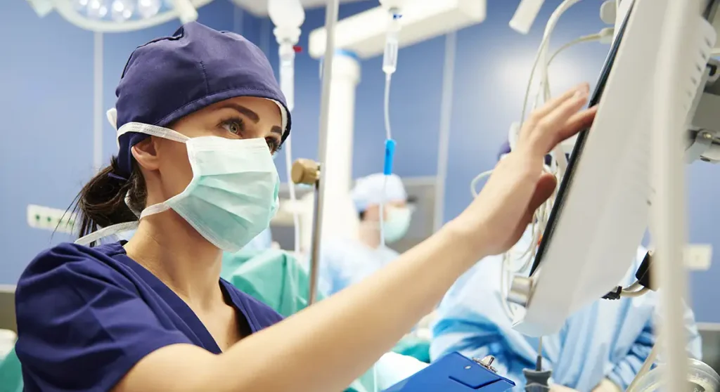 nurse working with technology in operating room