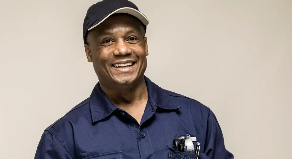 older man in work shirt and ballcap