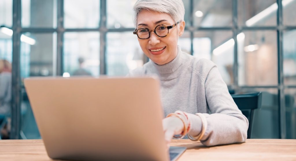 Professional woman using laptop