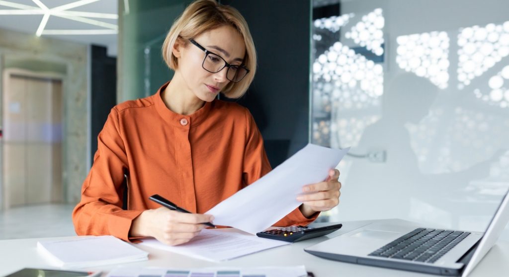 Professional looking at paperwork concernedly