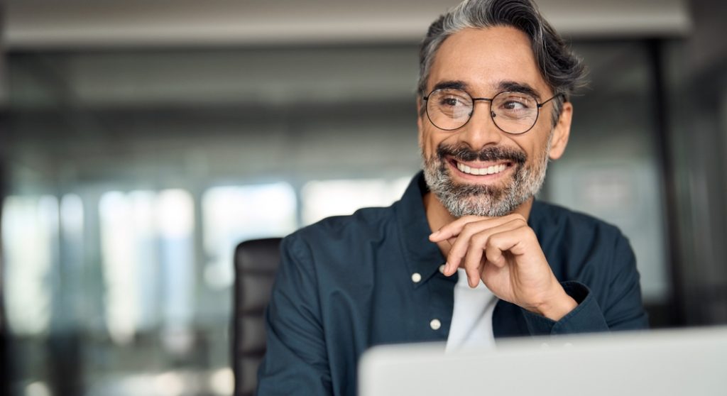 Mature businessman smiling in an office