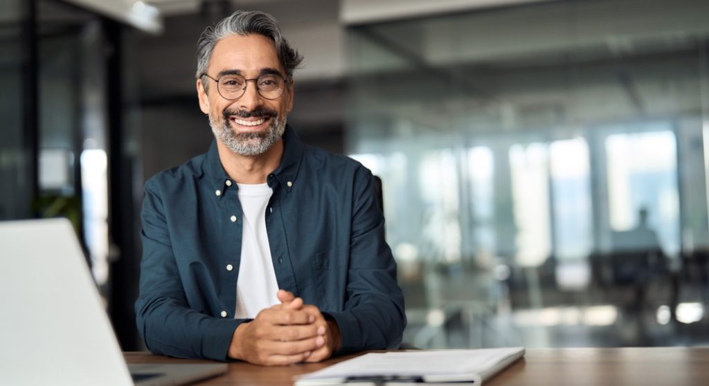 Happy middle aged professional business man