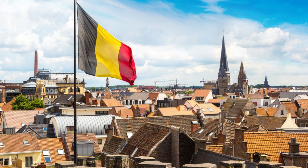 Belgian flag flying above city
