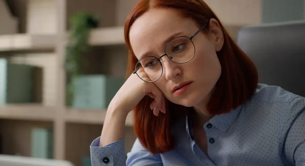 unmotivated woman bored with computer