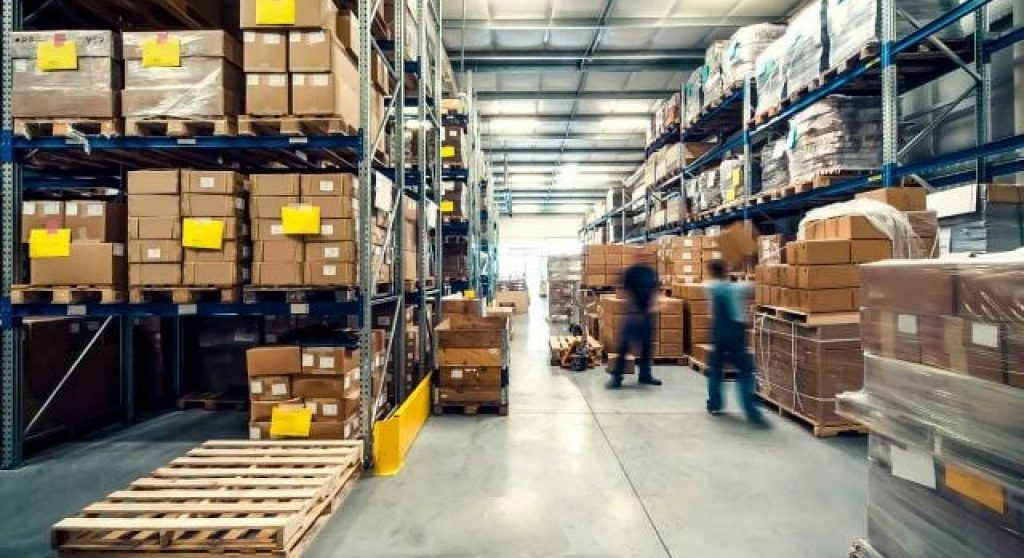 Warehouse workers moving boxes