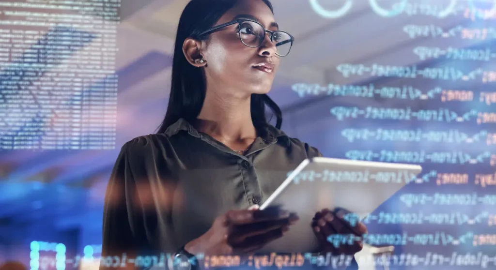 woman holding tablet looking at code