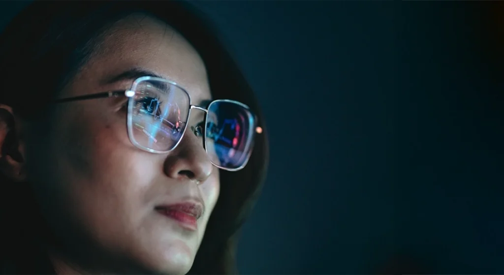 woman looking to future wearing glasses